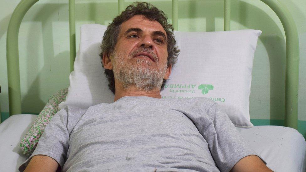 former Italian missionary Rolando Del Torchio waits for medical treatment at the Trauma Center Zamboanga city hours after his release from suspected Abu Sayyaf