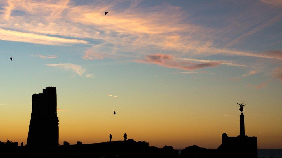 Adam Mulkern snapped this shot of seagulls swooping over Aberystwyth castle at sunset from his kitchen window