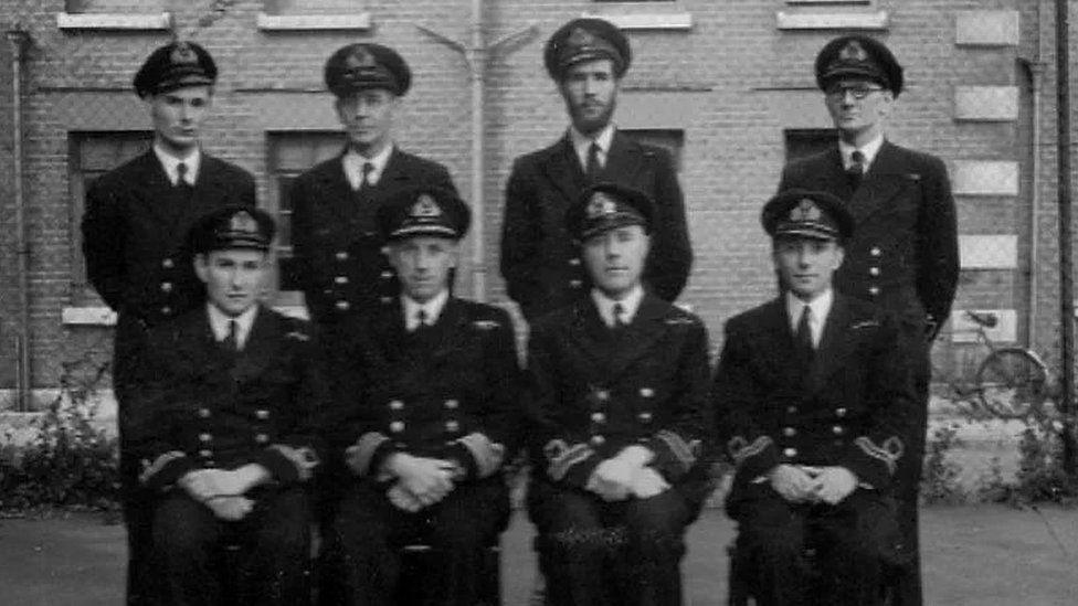 Boyd Salmon appears alongside seven other members of Royal Navy in military uniform