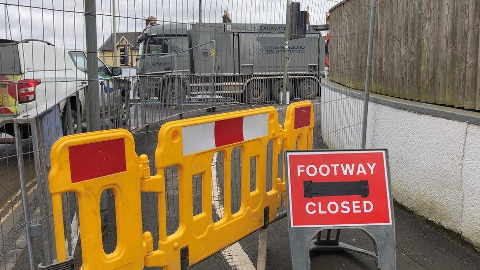 Footway closed sign on road