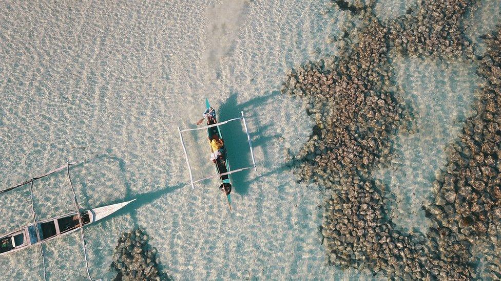 View from a drone of the waters around Diit island