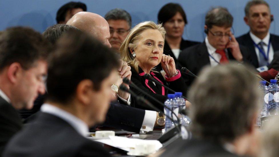 US Secretary of State Hillary Clinton (C) listens to proceedings during the North Atlantic Council (NAC) meeting at Nato headquarters in Brussels on 4 December 2012.