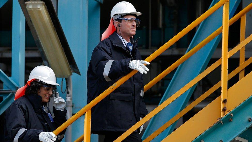 French Prime Minister Manuel Valls (R) and Labour Minister Myriam El Khomri climb stairs as they visit a factory of Belgian chemical company Solvay in Chalampe, eastern France (22 Feb 2016)