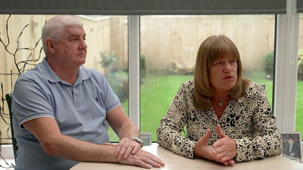 Former sub-postmaster Sharon Brown sitting next to her husband Kevin Brown at a kitchen table