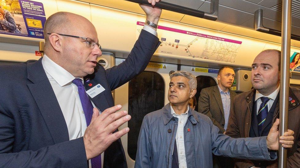 Transport for London commissioner, Andy Lord (left) talks to the Mayor of London Sadiq Khan(centre) on the Elizabeth Line