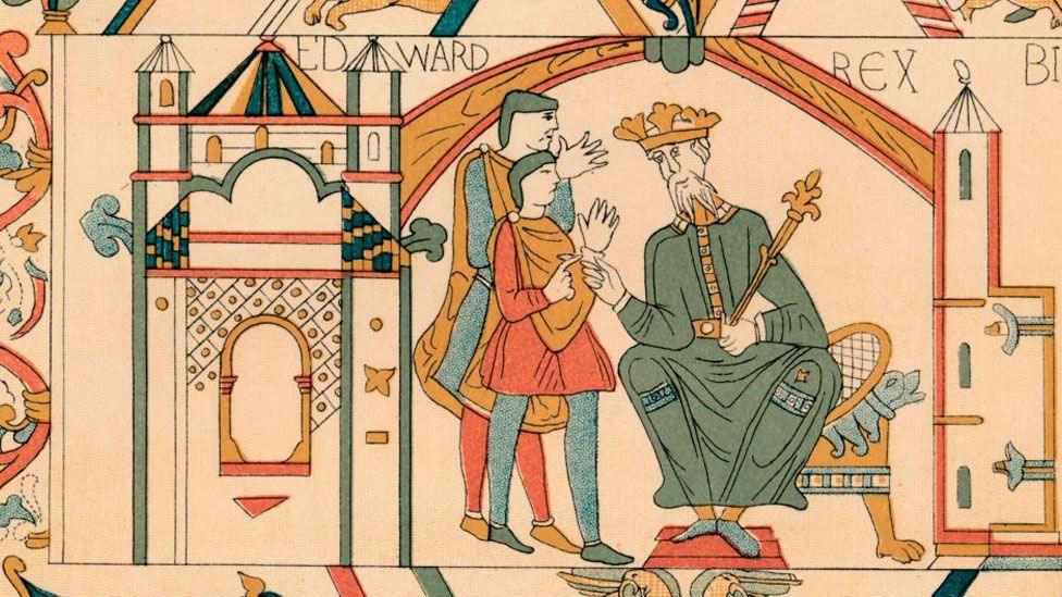 An artist's illustrtion taken from the Bayeux Tapestry. It shows Edward the Confessor wearing a long green robe sitting on a bench, wearing a crown, holding a sceptre and leaning to the left to give instructions to Harold Godwineson and another man. They are standing, wearing grey hose and short tunics and gesticulating