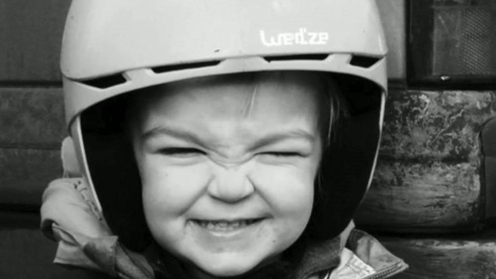 Kiara wearing a helmet and smiling for the camera