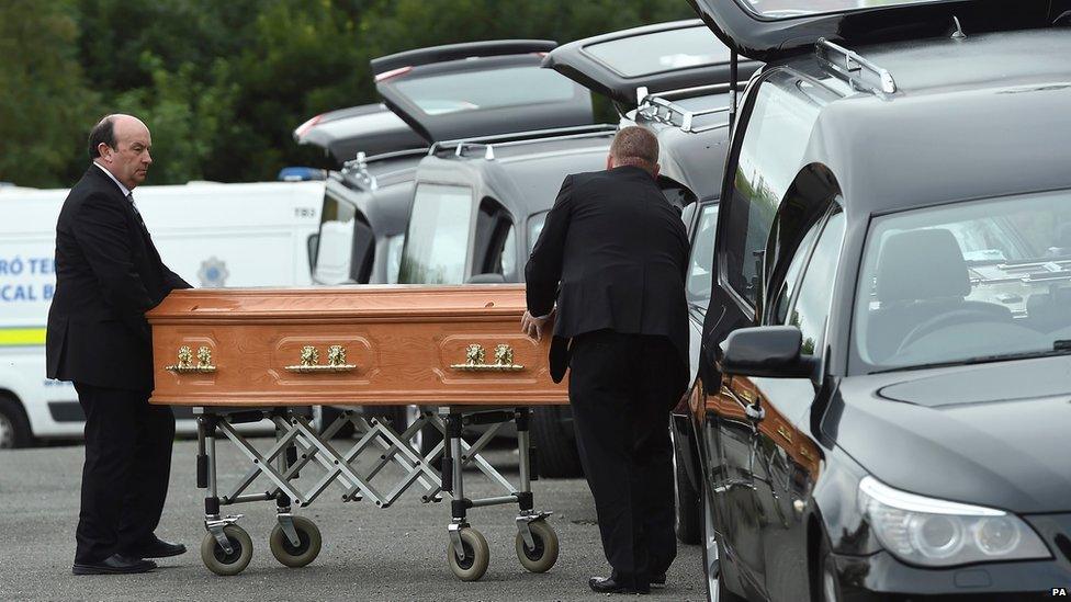 Coffins are taken to hearses in, Barconey, Ballyjamesduff in Cavan, 29 August 2016