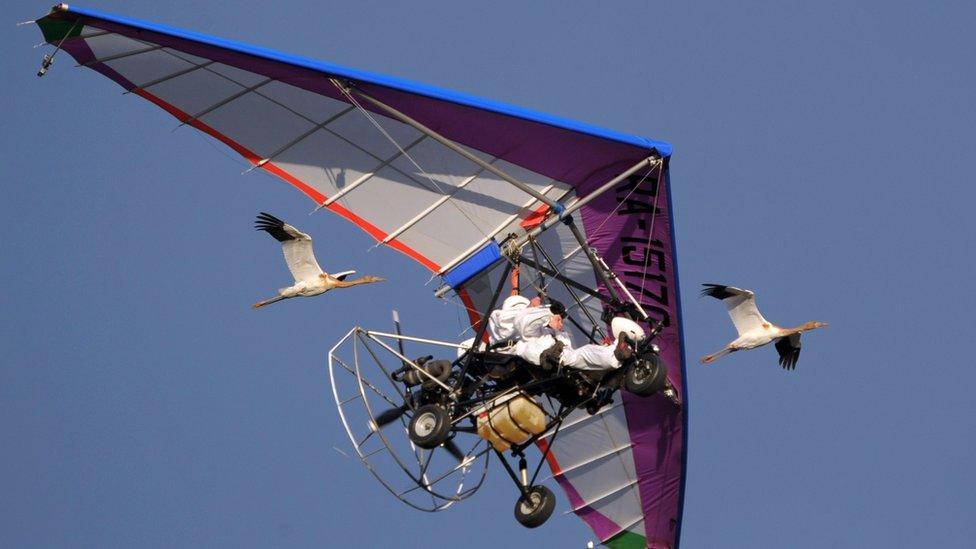 Vladimir Putin in a hang glider