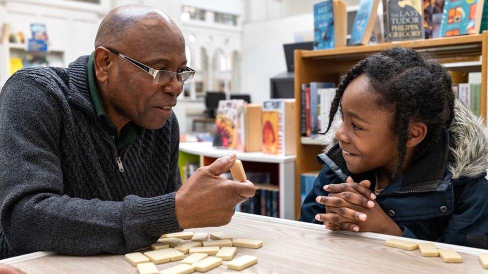 Jeremiah learning to play dominoes