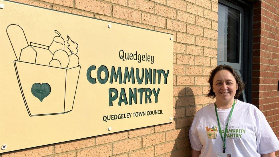 Councillor Vicky Ranford stood by the sign on the front of Quedgeley Community Pantry