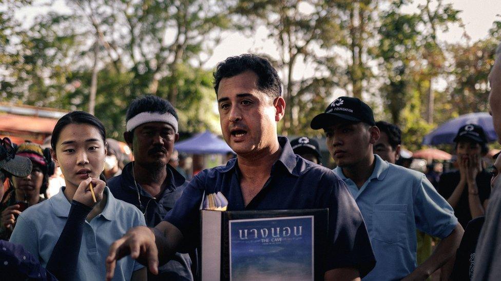 Writer/Director Tom Waller briefing actors on the set of The Cave shooting on location in Thailand.