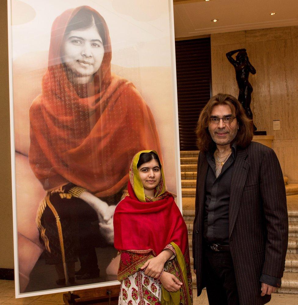 Nasser Azam and Malala Yousafzai next to his painting