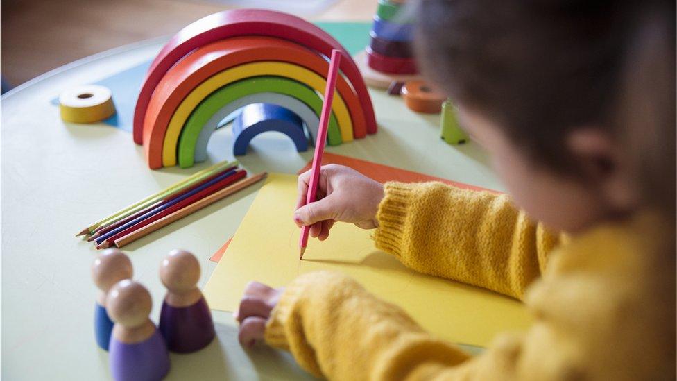 Young girl drawing picture