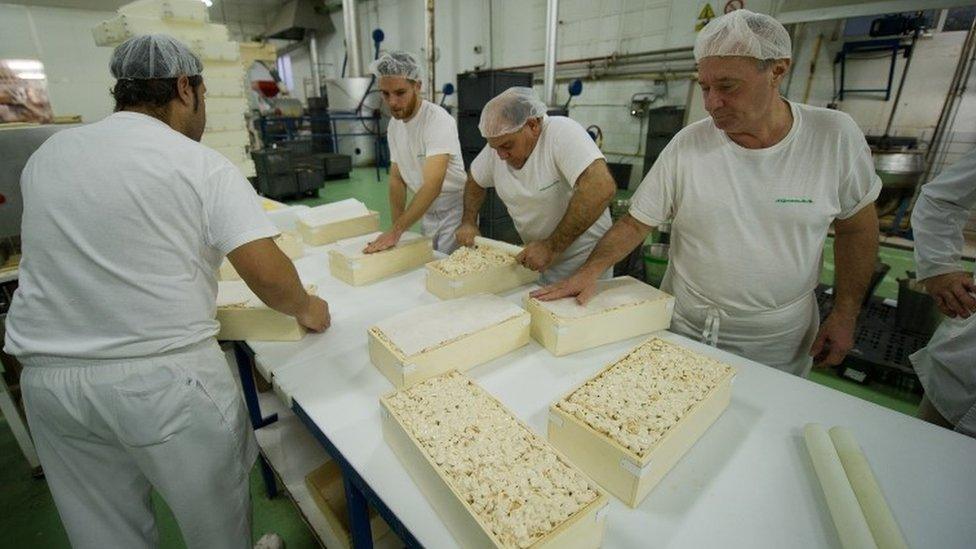 Spanish workers making a nougat confection known as turron