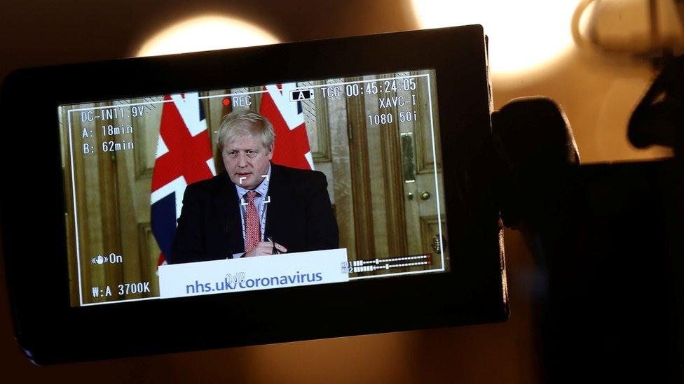 A camera films the Prime Minister Boris Johnson making a speech