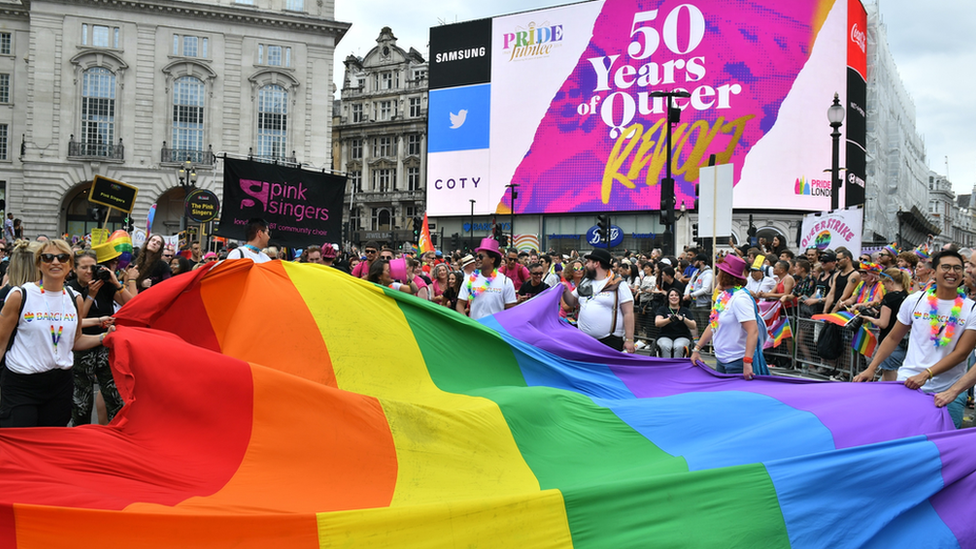 Celebrations during the 2019 Pride parade as the rainbow flag is carried through London's Piccadilly Circus