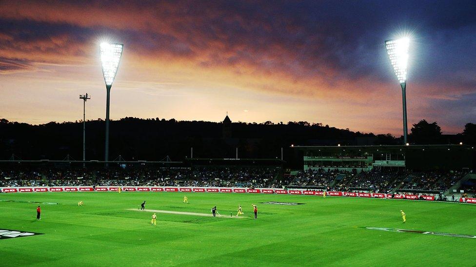 Sunset over cricket ground