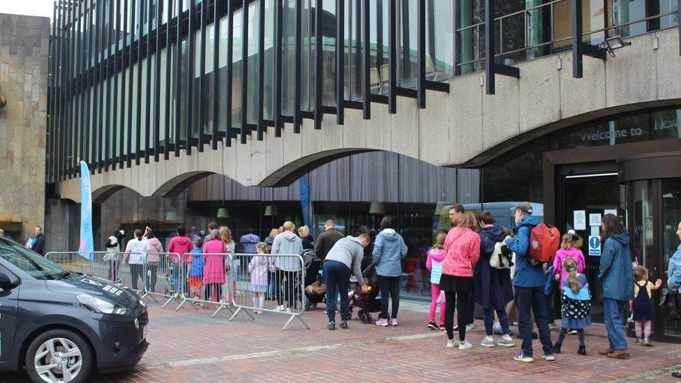 People queuing outside Newcastle Civic Centre