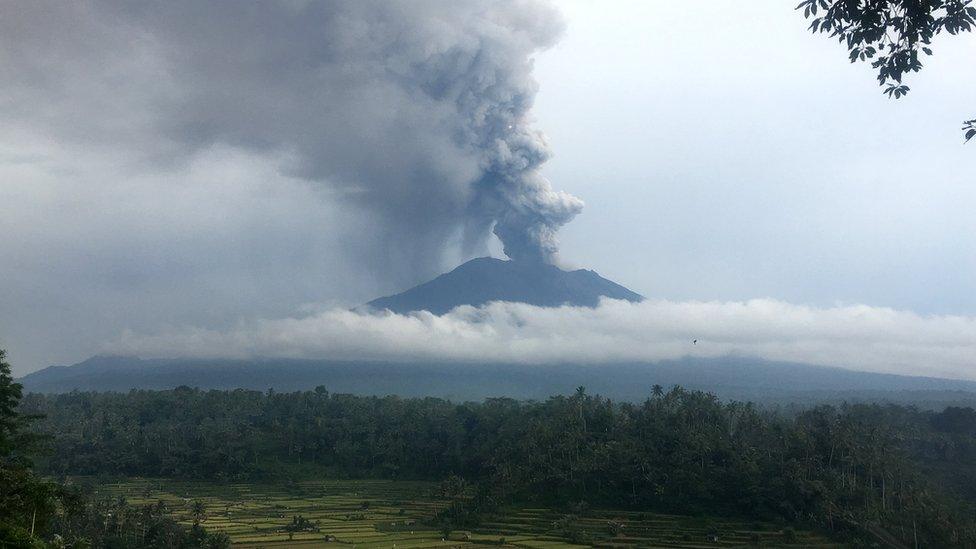 Smoke and ash rise from Mount Agung