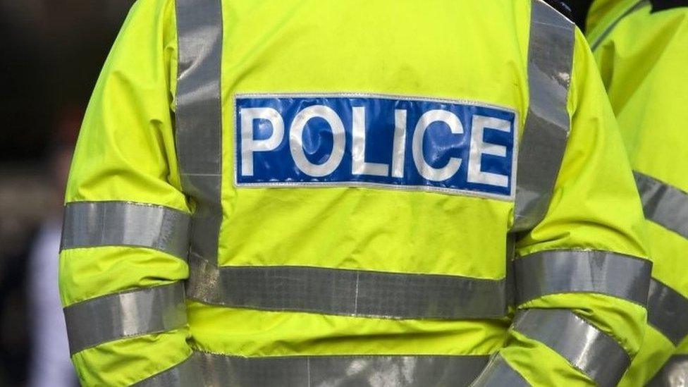 A stock image of a police officer wearing a hi-vis jacket