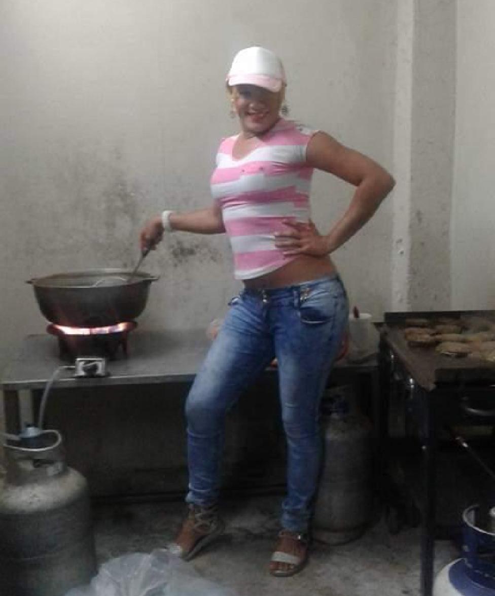 Monica cooking on a stove