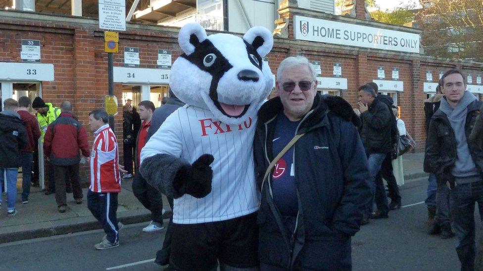 Jonathan Kotler with Billy the Badger, Fulham FC's mascot, outside Craven Cottage in west London