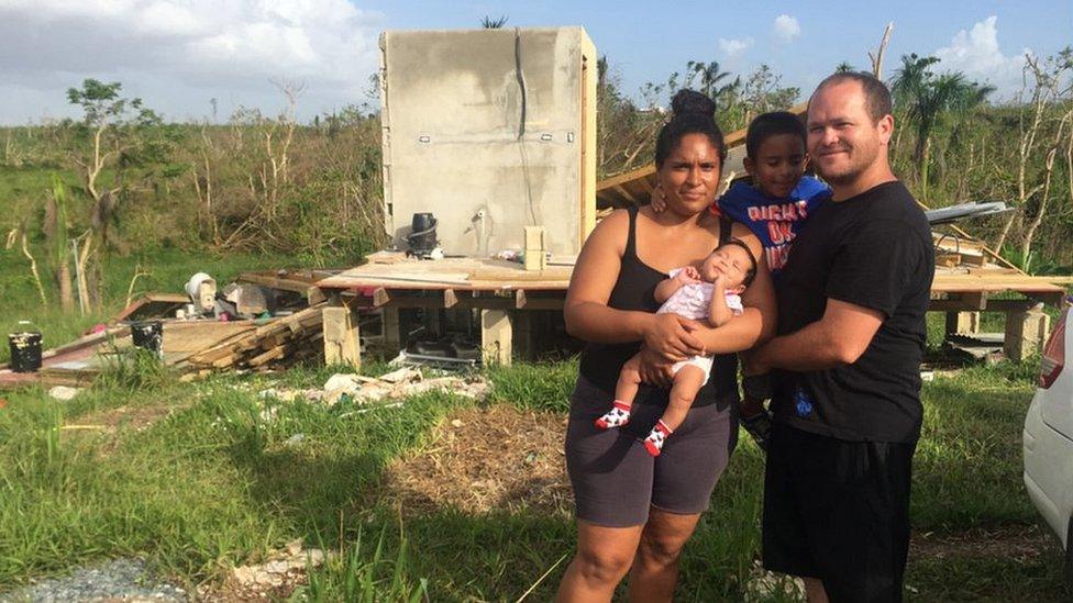 Jose Nieves and family at their wrecked home