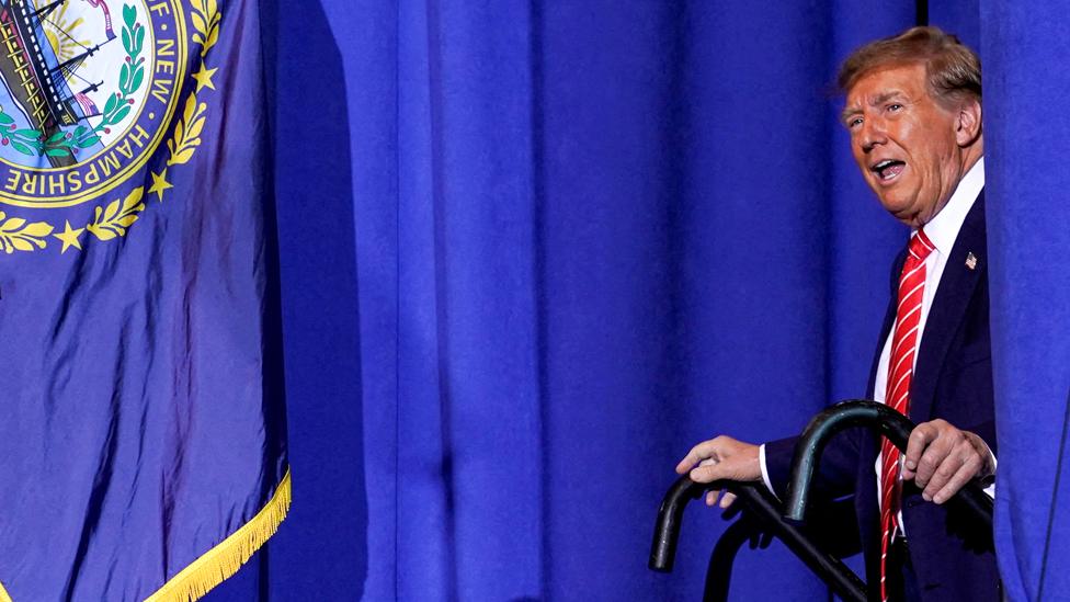 Former US President and Republican presidential candidate Donald Trump walks on to the stage at a rally ahead of the New Hampshire primary election in Concord, New Hampshire, US, on 19 January 2024