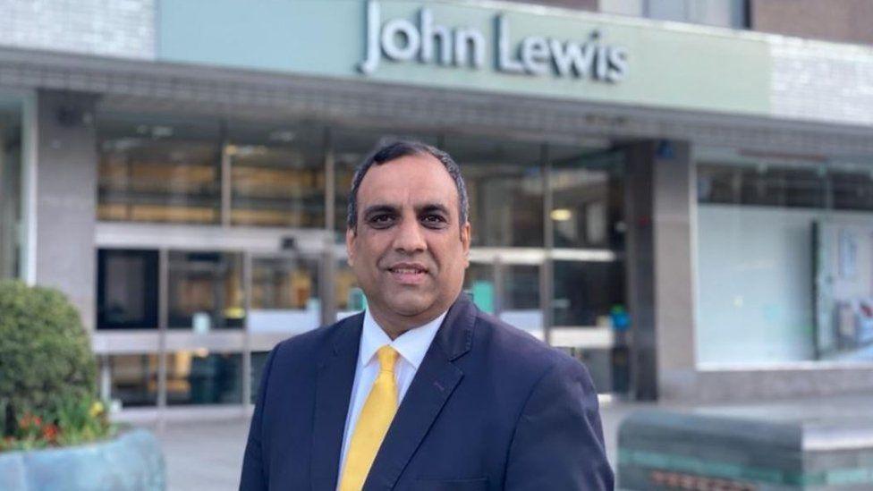 Councillor in front of John Lewis store