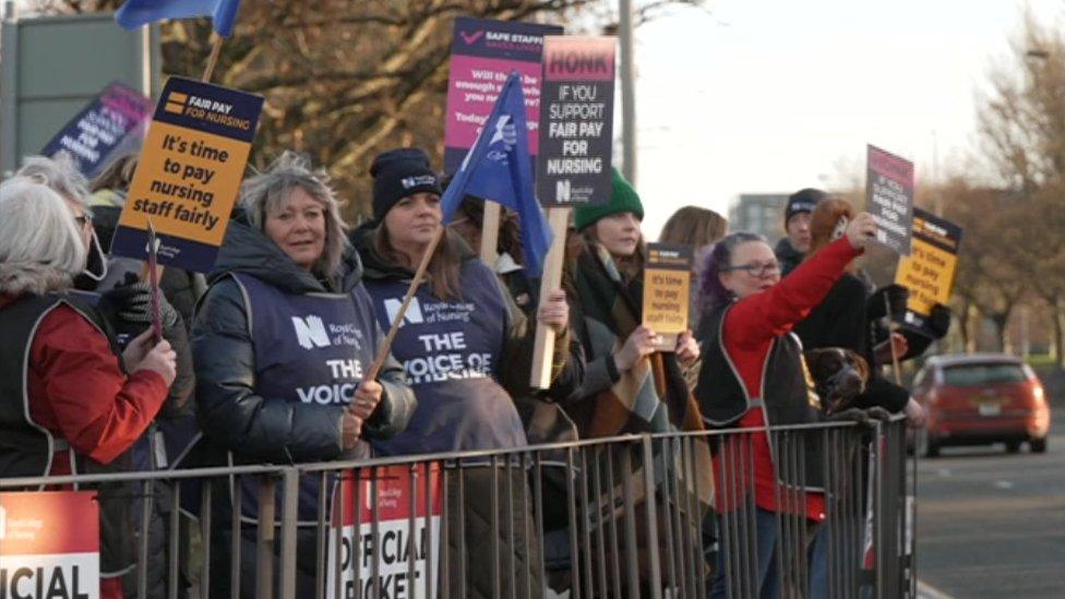 Women and a man at a picket line