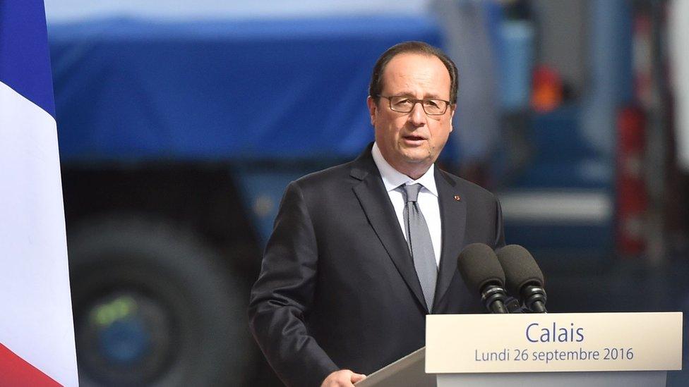 Francois Hollande stands by the French flag in Calais, 26 September 2016