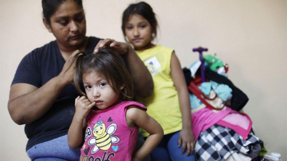 Migrant mother and two little girls