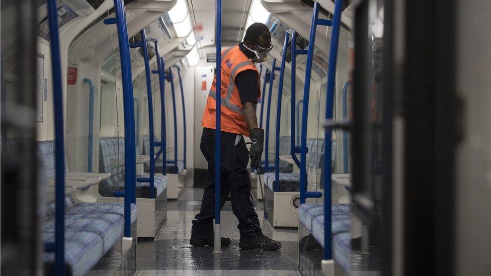 Cleaner on a London Underground train