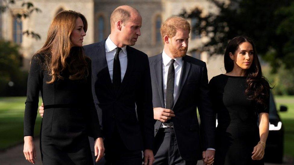 William, Prince of Wales, Catherine, Princess of Wales, Britain"s Prince Harry and Meghan, the Duchess of Sussex, walk outside Windsor Castle,