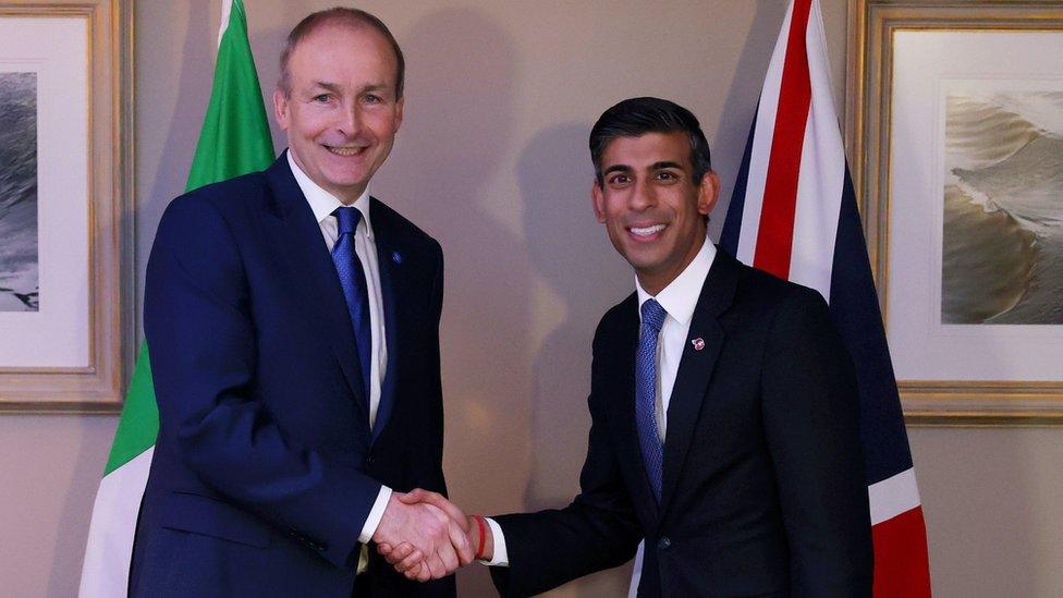 Micheál Martin shaking hands with Rishi Sunak