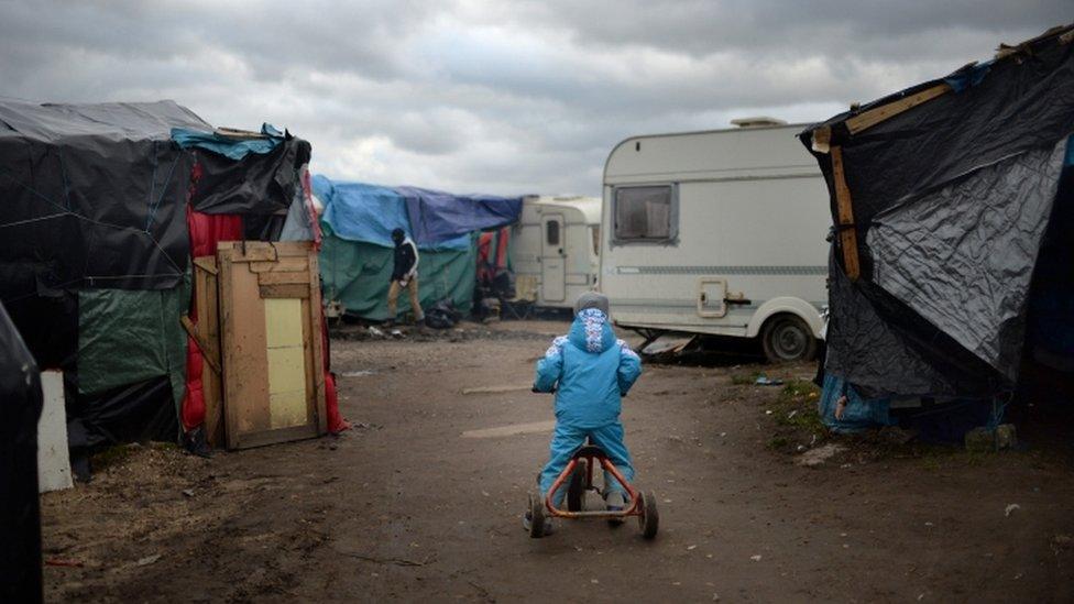 A child in a Calais refugee camp