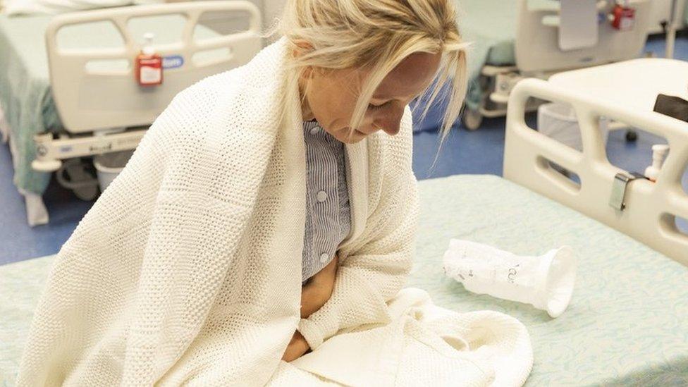 Woman on hospital bed