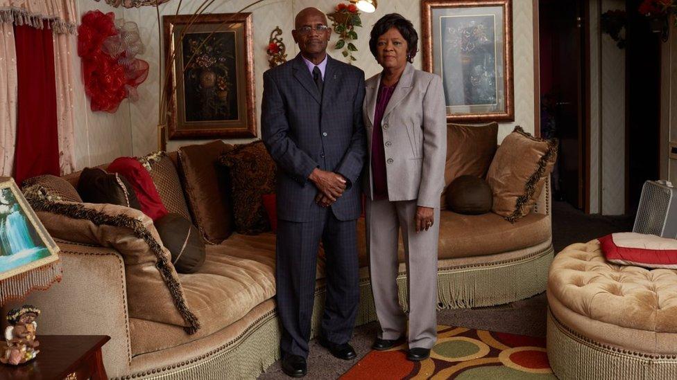 Archie and Lola Flowers pose for a portrait, on Sunday morning before church, in their living room in Winona, Mississippi. October 2017. Credit: Ben Depp for APM Reports