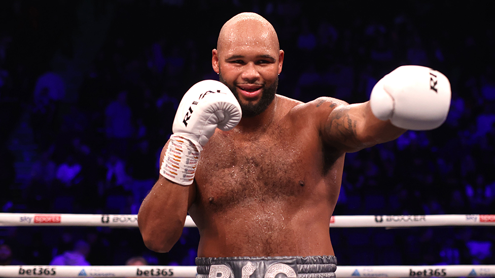 Frazer Clarke celebrates victory against Kamil Sokolowski in the heavy-weight bout at the AO Arena, Manchester