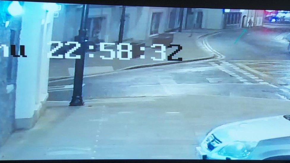 CCTV SHOWS HIM CROSS CAsTLE STREET and through an archway