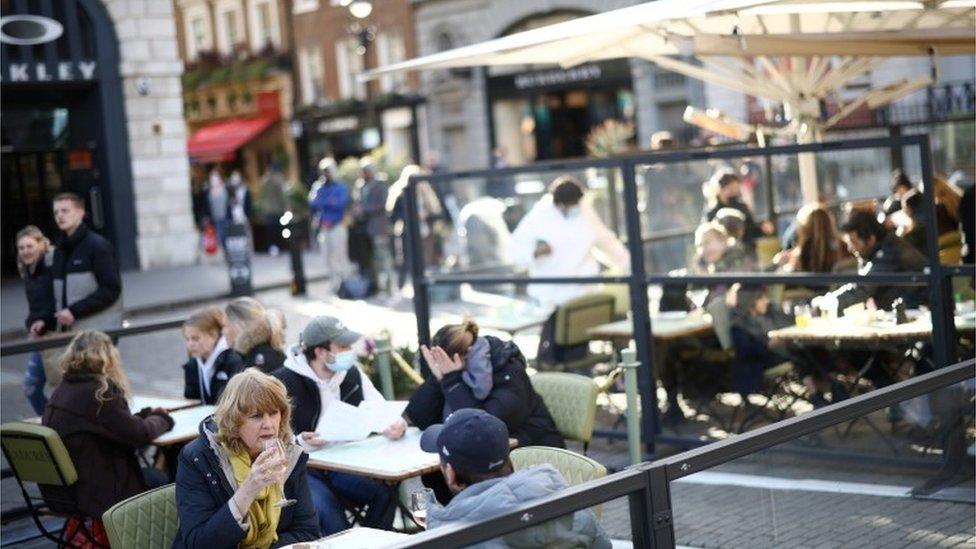 People eating outside in Covent Garden