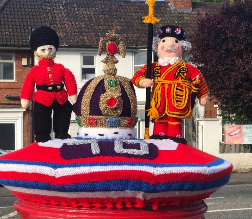 The knitted post box topper outside Sea Mills Post Office