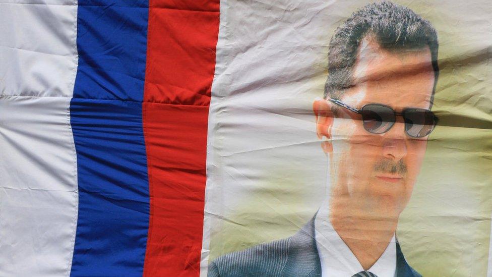 Russian flag with portrait of Bashar al-Assad (file photo)