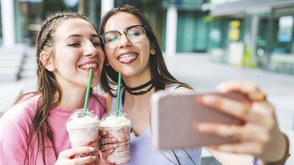 Stock image of teenagers taking a selfie