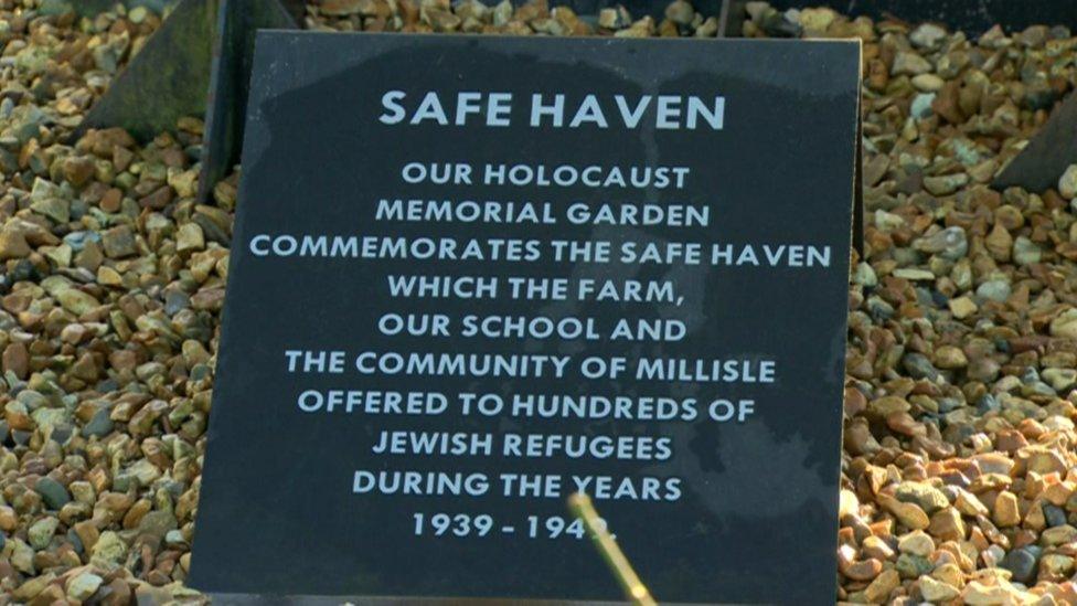 Memorial outside the school which reads: safe haven. Our holocaust memorial garden commemorates the safe haven which the farm, our school and the community of Millilse offered to hundreds of Jewish refugees during the years 1939-1942