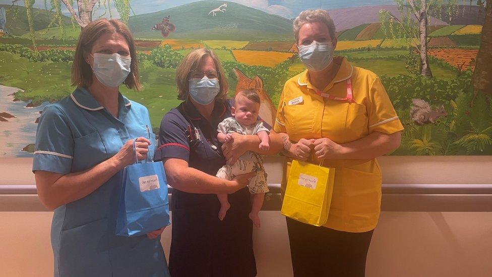 Nurses on the neonatal ward with George and the care packs