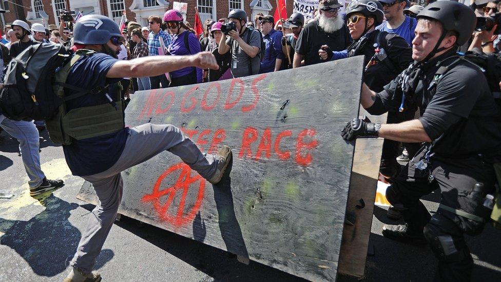 White nationalists, neo-Nazis and members of the 'alt-right' clash with counter-protesters as they enter Emancipation Park during the 'Unite the Right' rally August 12, 2017 in Charlottesville, Virginia