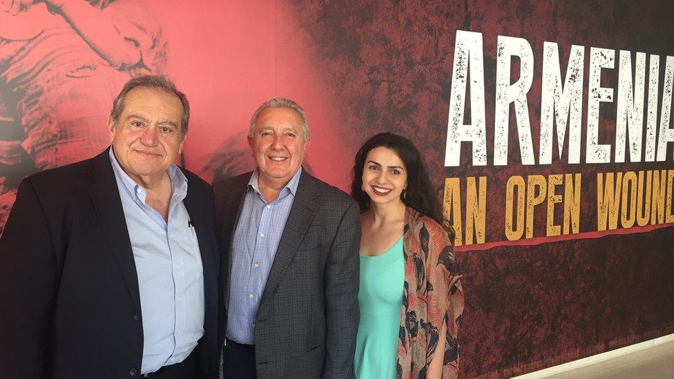 Zaven Kazazian, Berdj Karapetian and Tigrana Zakaryan stand at the entrance to the Armenian exhibit at the Brand Museum in Glendale