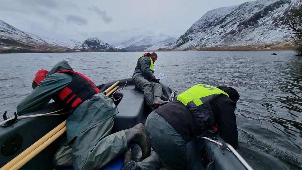 West Cumbria Rivers Trust and National Trust staff surveying for New Zealand Pigmyweed in Crummock Water in the winter